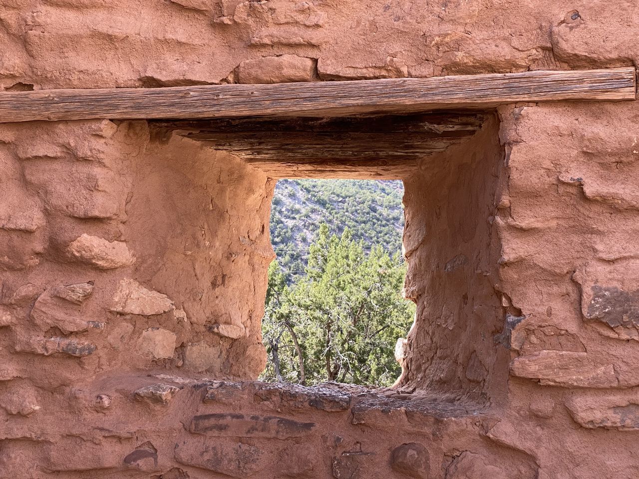 LOW ANGLE VIEW OF WINDOW ON OLD WALL