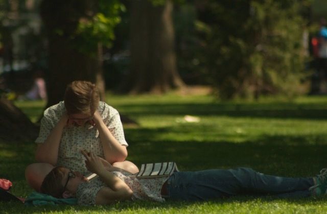 lifestyles, leisure activity, sitting, relaxation, casual clothing, grass, tree, person, focus on foreground, resting, rear view, lying down, field, park - man made space, full length, men, relaxing, young adult