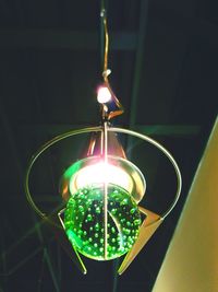 Low angle view of lit light bulb