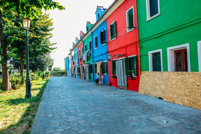 Street amidst buildings against sky