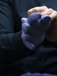 Close-up of man holding hands