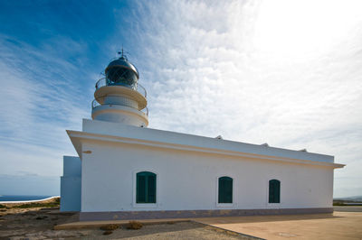 Low angle view of built structure against clouds