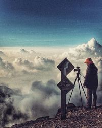 Scenic view of mountains against cloudy sky