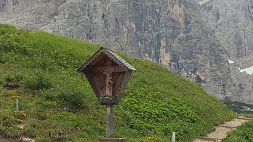 Built structure on road amidst trees and buildings