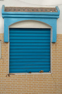 Blue wooden window in the old medina of asilah