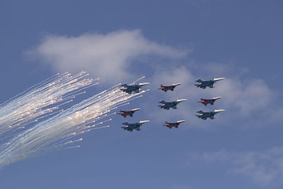 Low angle view of airshow in sky