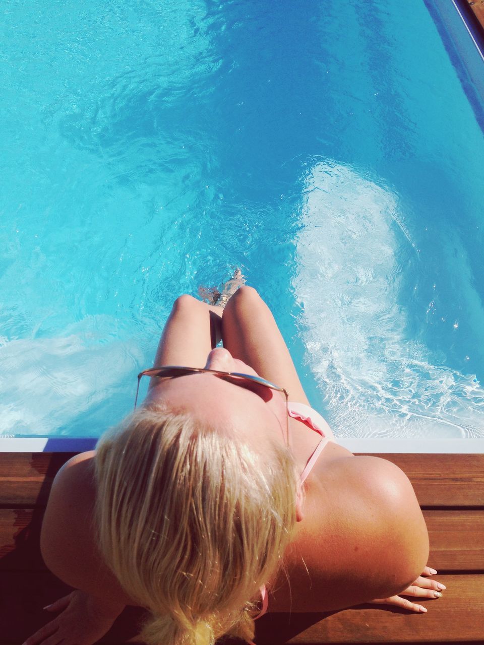 water, lifestyles, swimming pool, leisure activity, sea, young women, person, blue, young adult, relaxation, bikini, vacations, swimming, shirtless, sunlight, barefoot, sitting