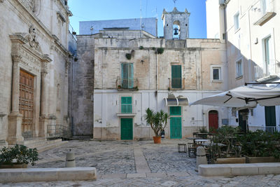 A square in the historic center of monopoli, a town in the puglia region, italy.