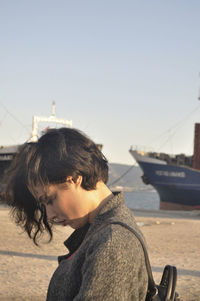 Portrait of senior man in sea against clear sky