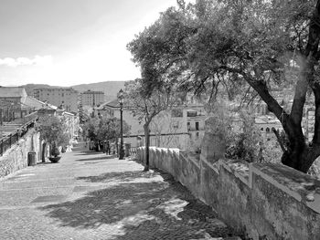 Street amidst buildings against sky