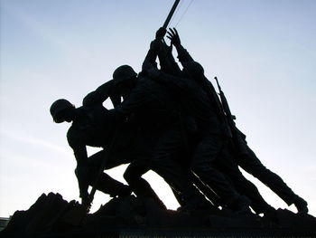 Low angle view of statue against sky