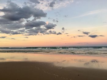 Scenic view of sea against sky at sunset