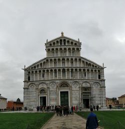 Group of people in front of historical building