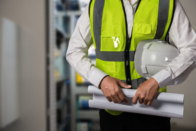 Rear view of man working in factory