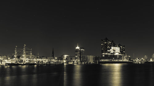 Illuminated buildings in city at night