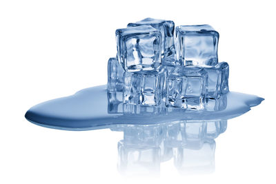 Close-up of beer in water against white background