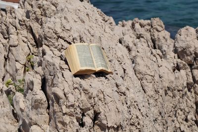 High angle view of book on rock