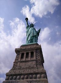 Low angle view of statue against cloudy sky