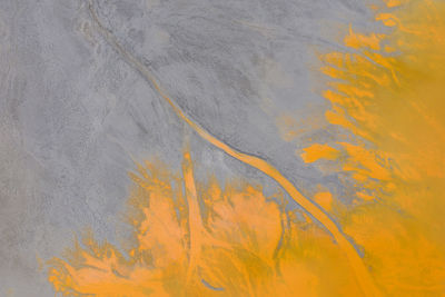 Aerial drone abstract natural pattern. yellow chemical toxic water polluting the nature