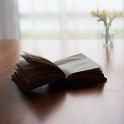 Close-up of book on wooden table