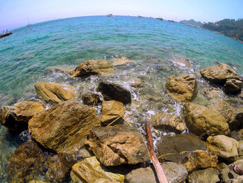 Rocks on shore against sky