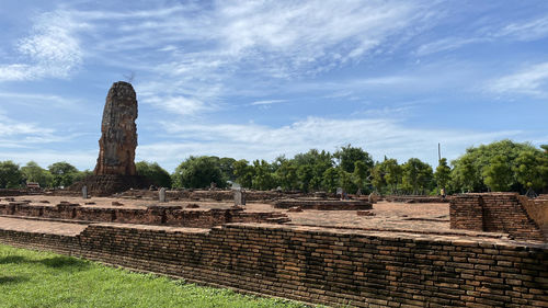 Old ruins of temple against cloudy sky