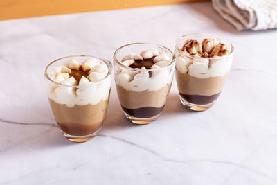 Assortment of mini chocolate desserts in the glass. mini choloate desserts on a rustic background