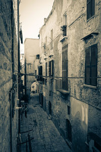 Narrow street amidst buildings in town