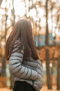 Rear view of woman standing outdoors