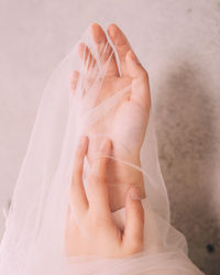 Close-up of woman holding veil