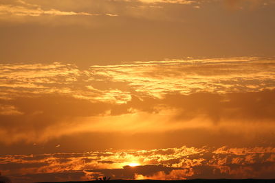 Low angle view of dramatic sky during sunset