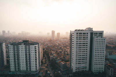 Modern buildings in city against clear sky