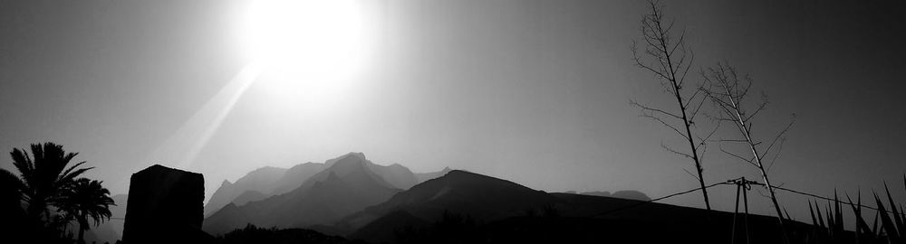 Scenic view of sunset over mountains