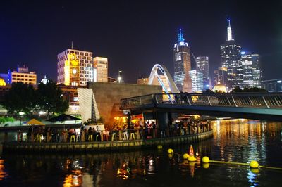Illuminated city at waterfront