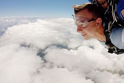 Woman with arms raised in mountains