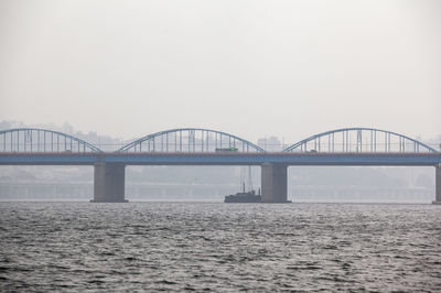 Mid distance view of dongjak bridge over han river against clear sky