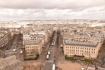 High angle view of buildings in city against sky