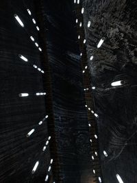 Low angle view of illuminated lights on ceiling