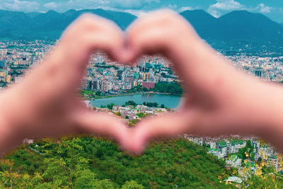 Close-up of hand over heart shape