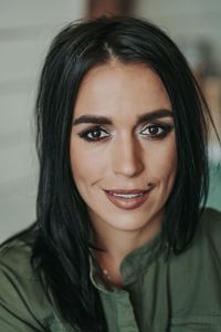 Portrait of smiling woman at home