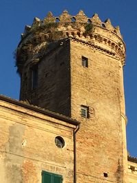 Low angle view of historic building against sky