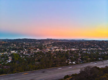 High angle view of townscape against sky at sunset