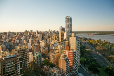 High angle view of buildings against clear sky