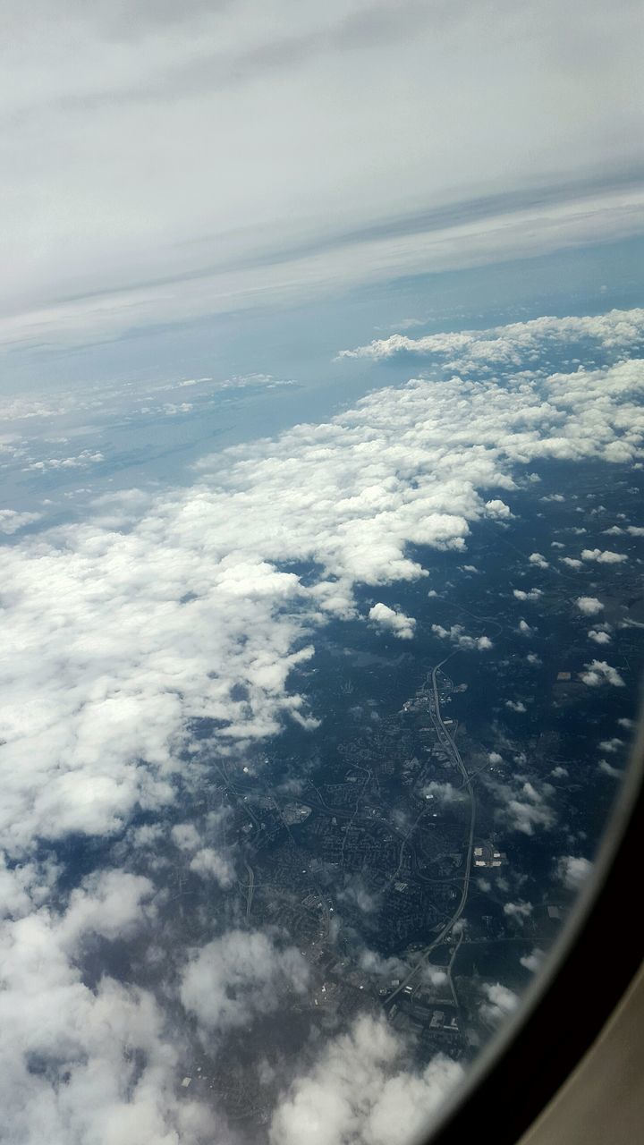 transportation, airplane, mode of transport, air vehicle, vehicle interior, aerial view, window, sky, transparent, glass - material, aircraft wing, part of, scenics, flying, travel, cropped, landscape, beauty in nature, cloud - sky, nature