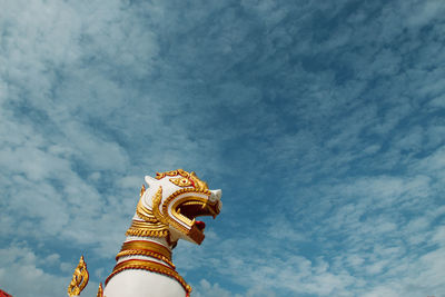 Low angle view of statue against sky