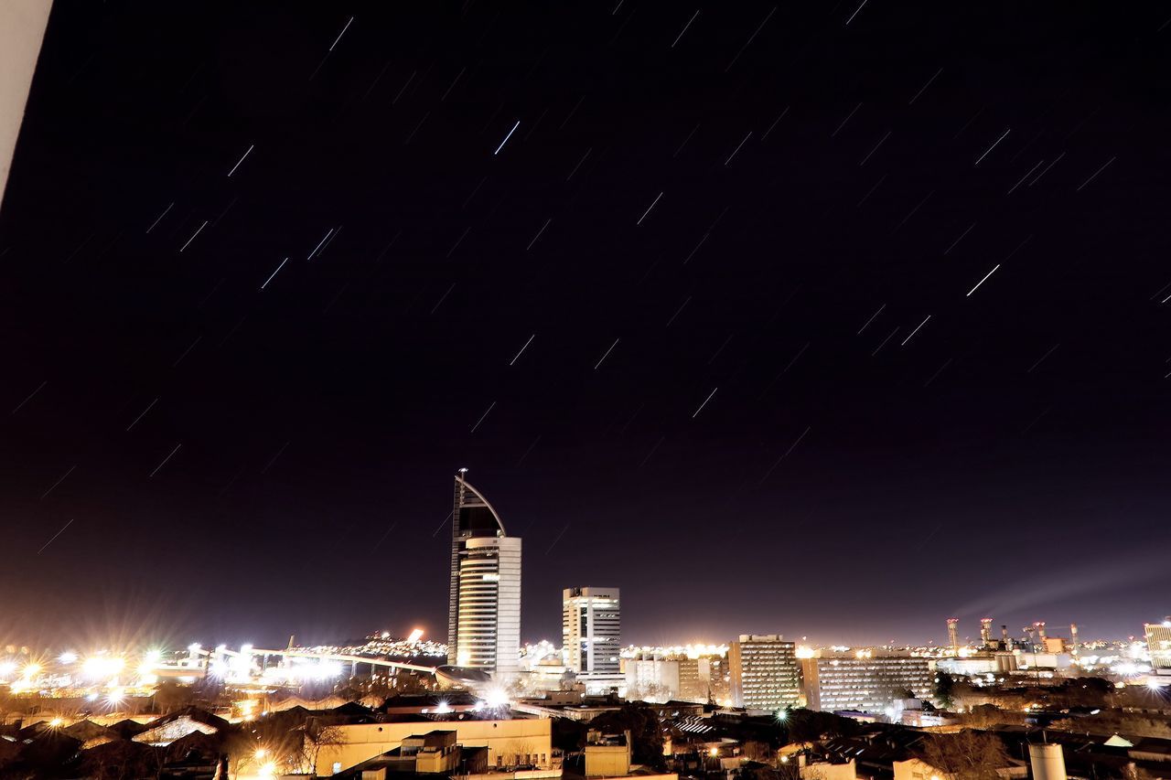 night, building exterior, built structure, architecture, illuminated, city, skyscraper, cityscape, scenics, tall - high, tower, sky, development, modern, urban skyline, tall, outdoors, dark, tranquility, beauty in nature, tranquil scene, high section, apartment, skyline, city life, no people