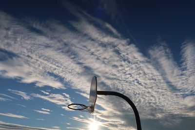 Low angle view of silhouette street light against sky