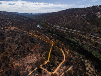 High angle view of road amidst mountains against sky