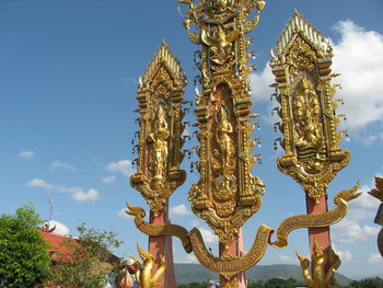 Low angle view of statue against sky