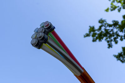 Low angle view of pole against clear blue sky